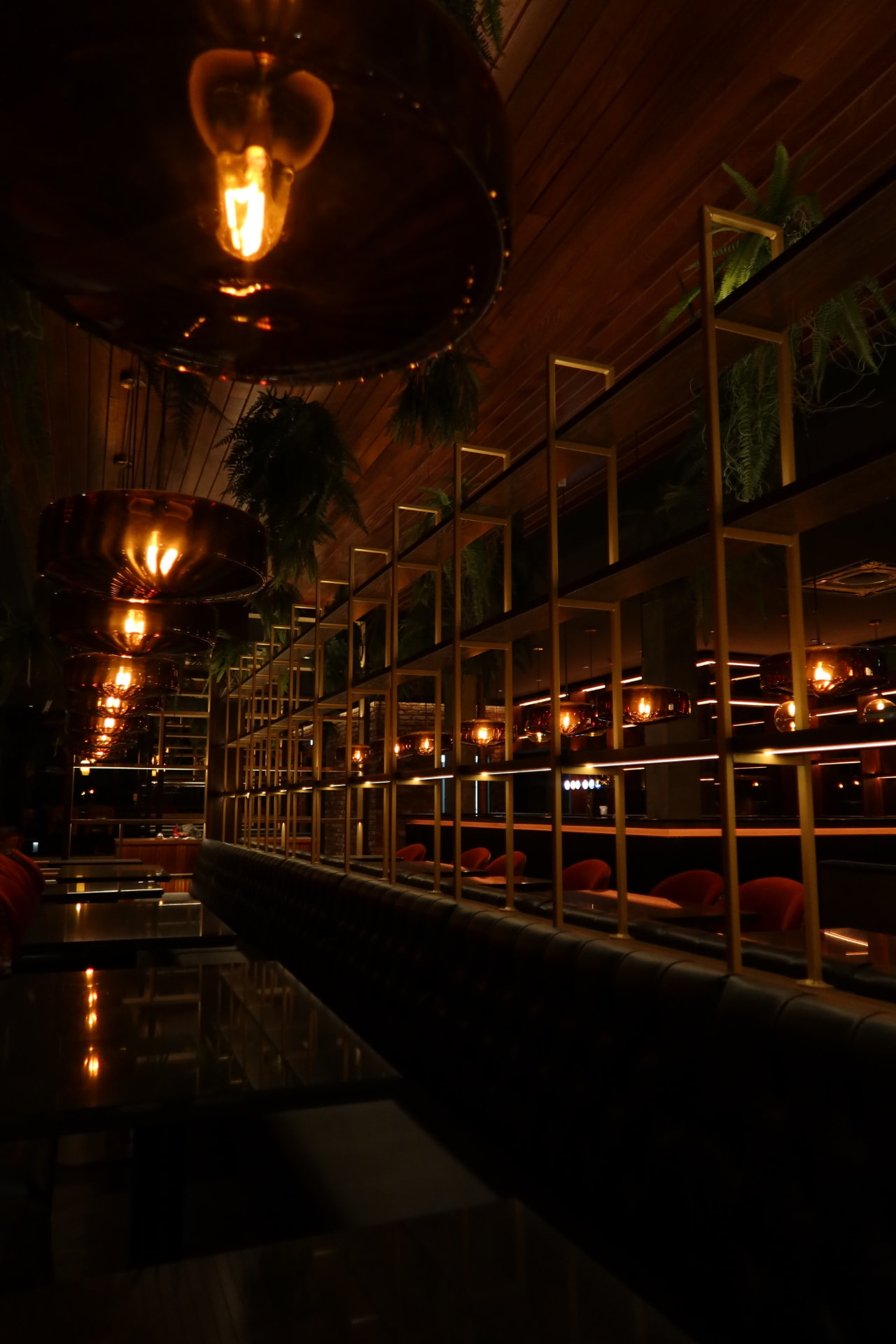 Brass screens and leather banquettes in the private dining room